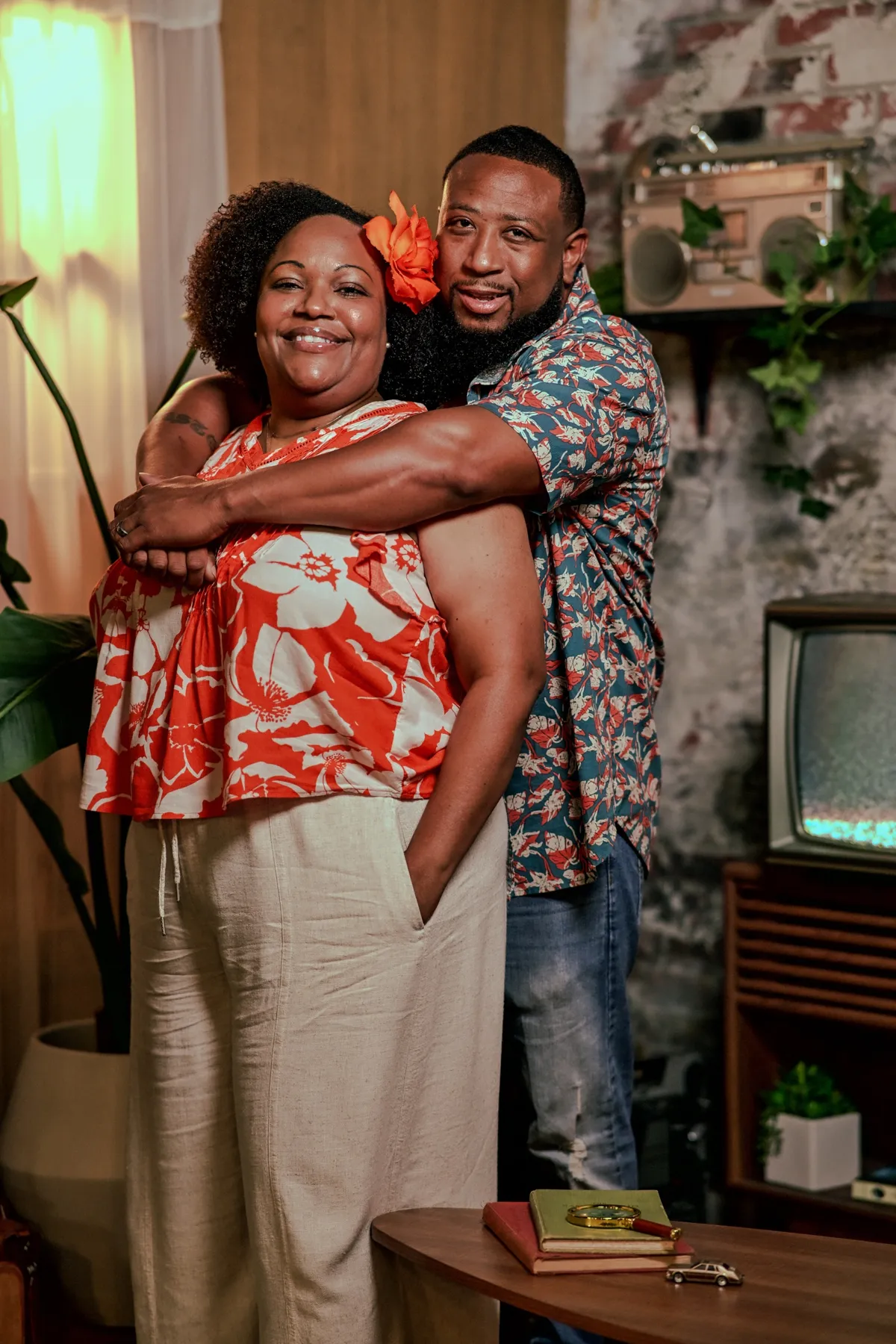 Couple embracing in a retro living room set
